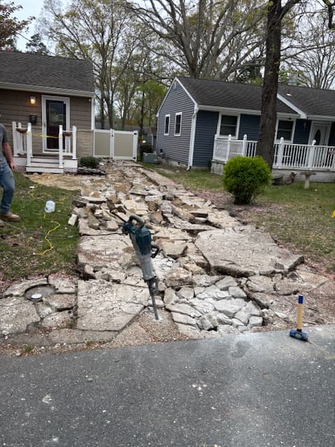 Jackhammer demolition of an old concrete front walkway at a Somers Point, NJ home