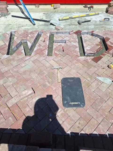 Finished custom herringbone paver patio in a South Jersey backyard