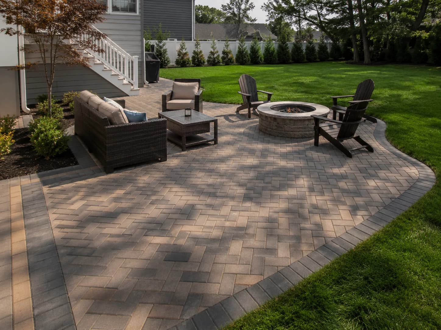 Finished paver patio with fire pit installed by T.W. Outdoor Services in South Jersey