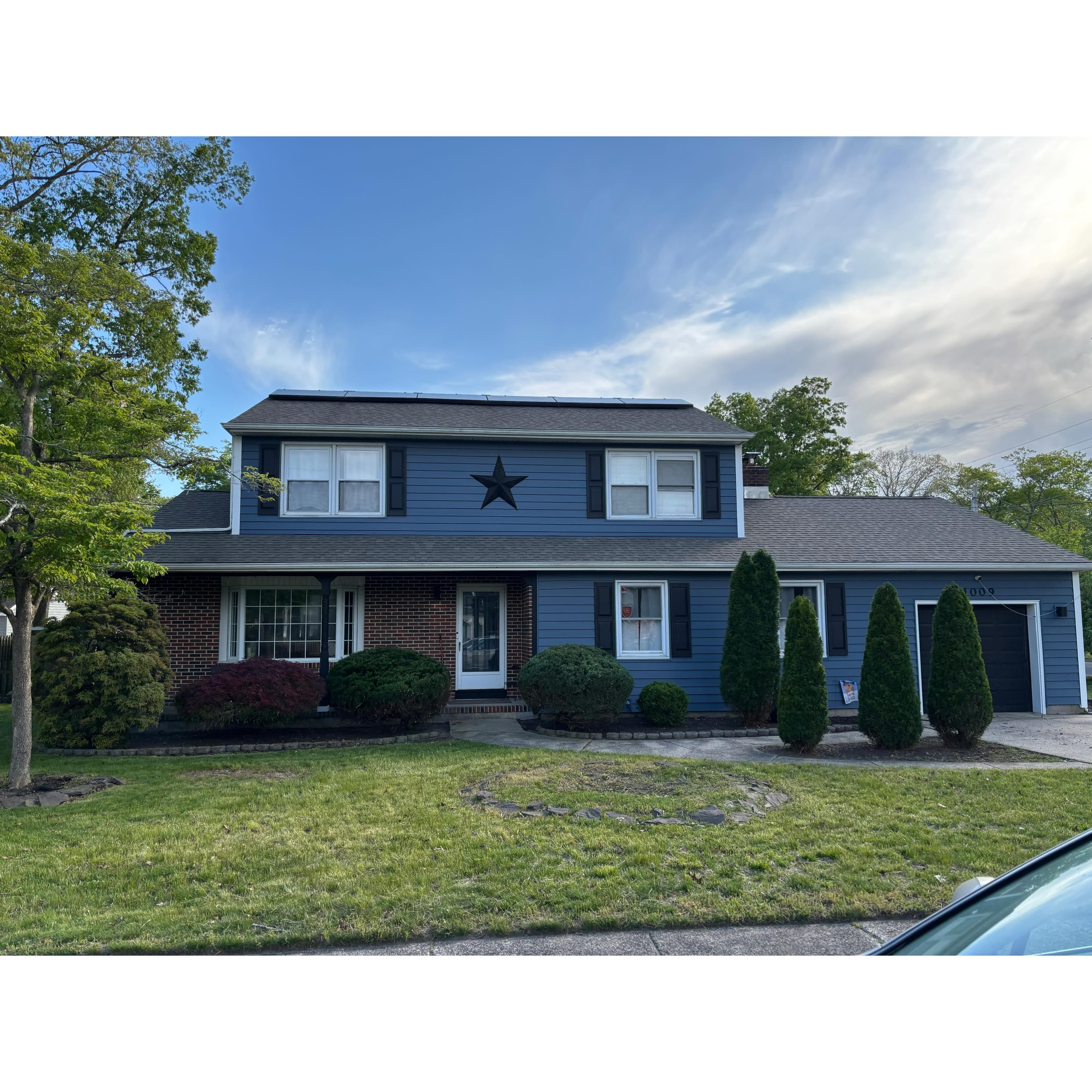 Refreshed front yard with fresh mulch beds and trimmed shrubs at a Margate, NJ home